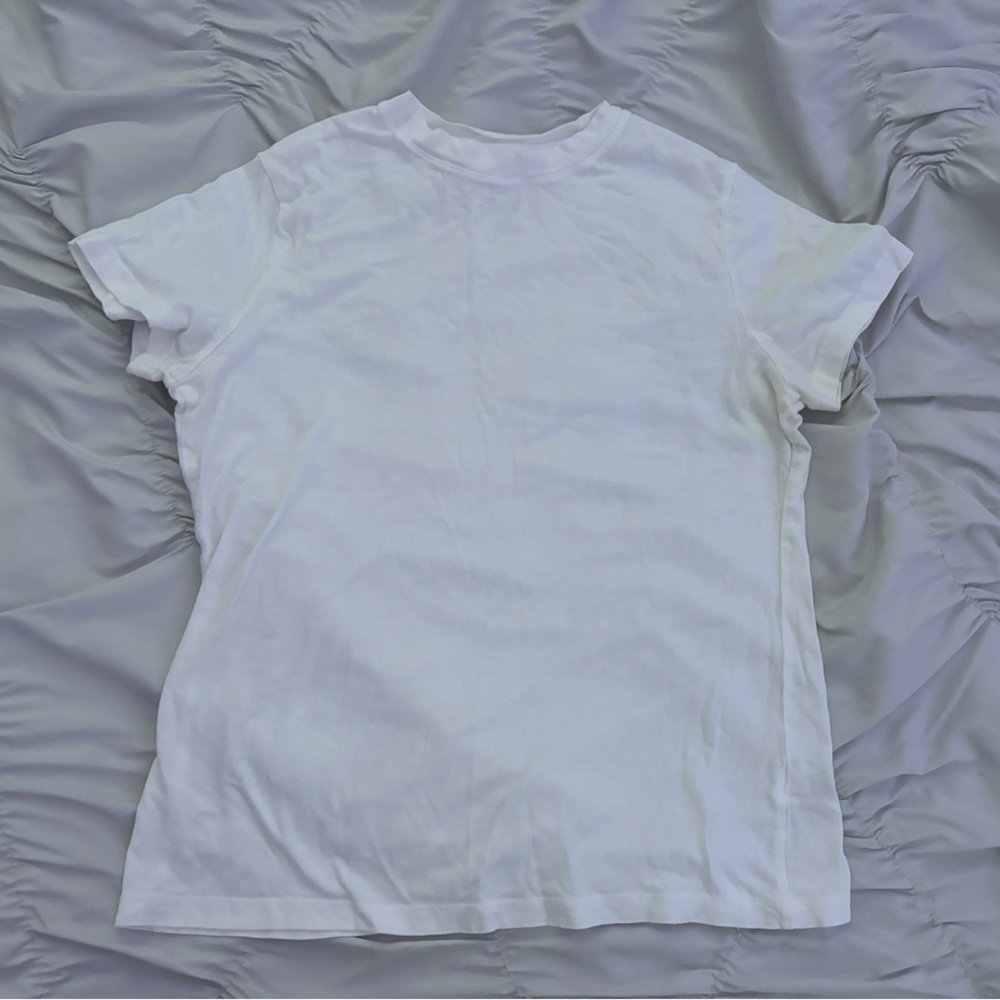 A New Day white tee
